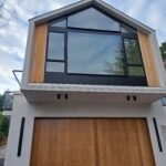 modern new build home exterior with wood siding and large windows Palo Alto