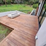 custom wood deck with concrete fire feature and modern backyard design Los Altos Hills