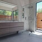 Modern freestanding bathtub installation in Bay Area home