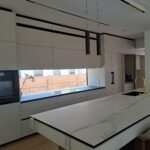 elegant European-style white kitchen cabinets installed in a modern kitchen