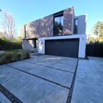 modern luxury home exterior with wood siding concrete driveway and clean design Menlo Park